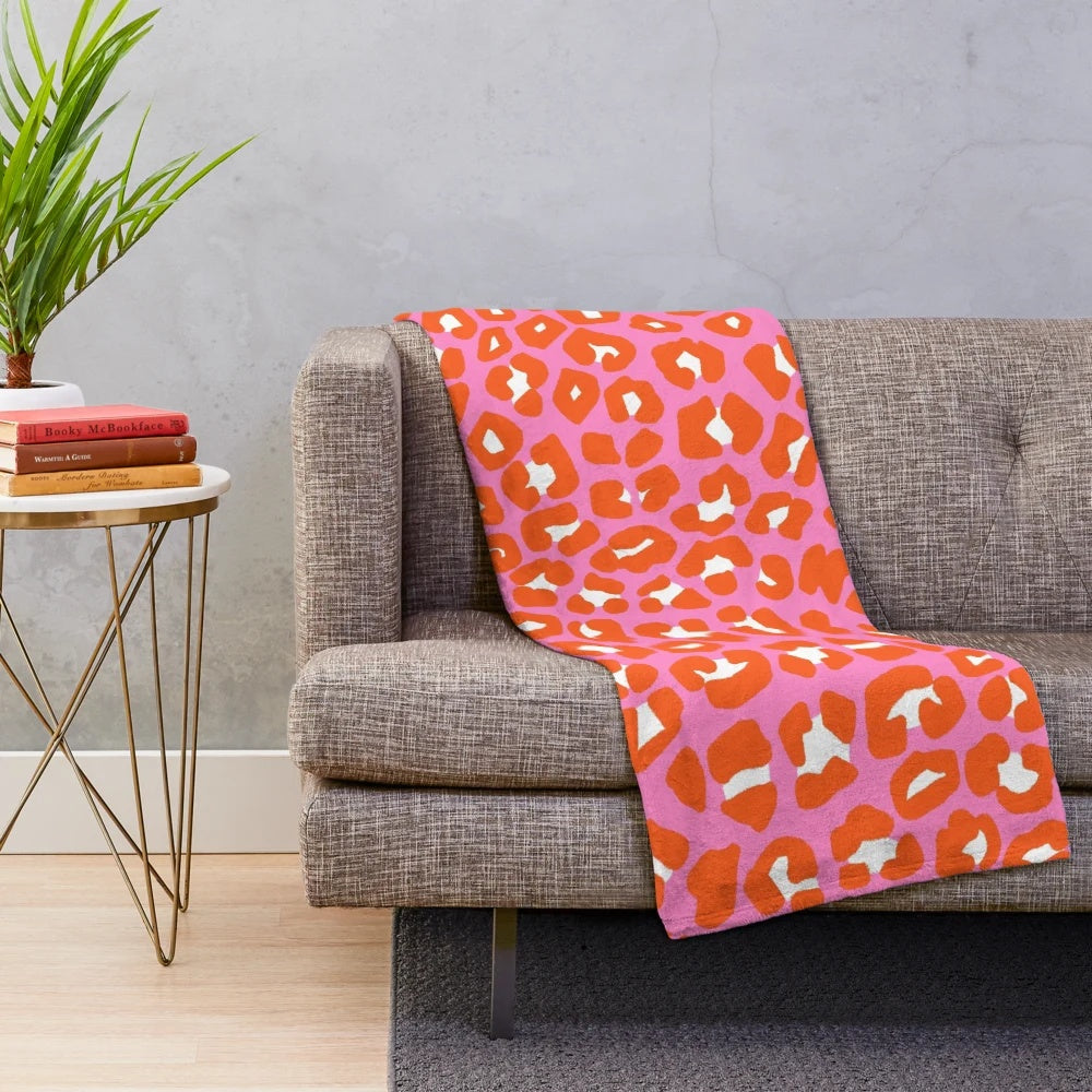 Colorful leopard print plush blanket with celestial and space design