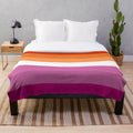 Soft, plush blanket in the colors of the new lesbian pride flag