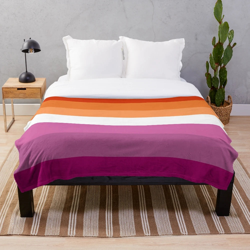 Soft, plush blanket in the colors of the new lesbian pride flag
