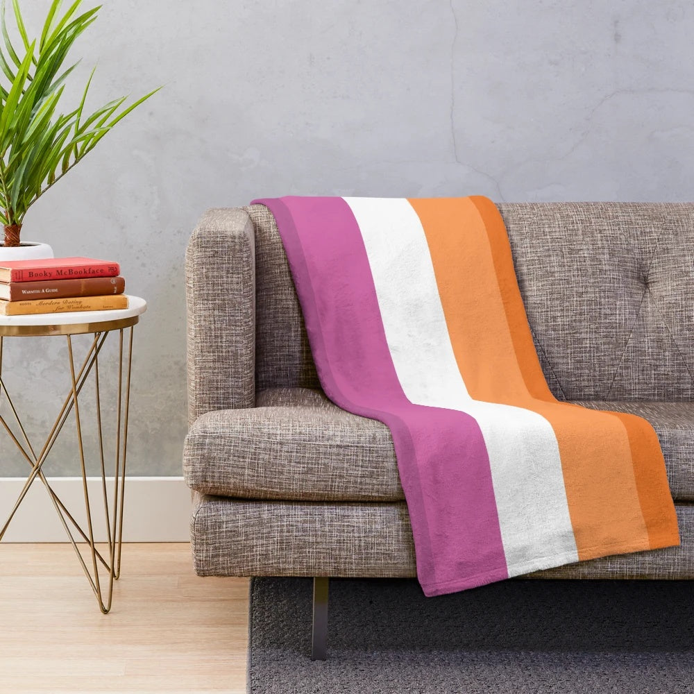Soft, plush blanket in the colors of the new lesbian pride flag