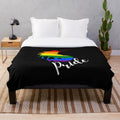 Colorful plush blanket featuring a unicorn in rainbow flag colors