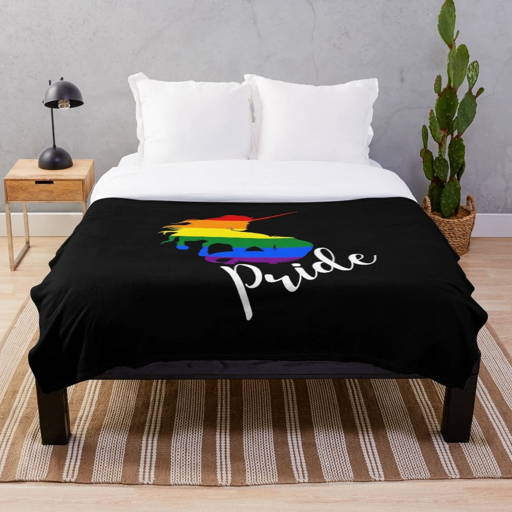 Colorful plush blanket featuring a unicorn in rainbow flag colors