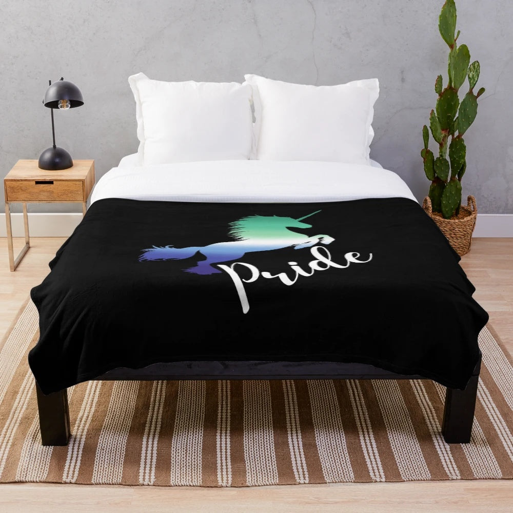 LGBTQ pride-themed unicorn plush blanket in colorful rainbow design