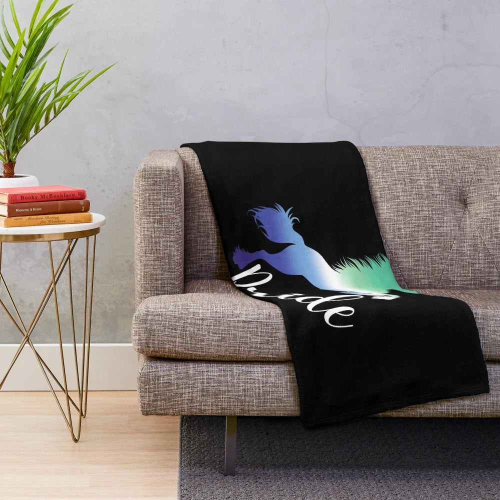 LGBTQ pride-themed unicorn plush blanket in colorful rainbow design