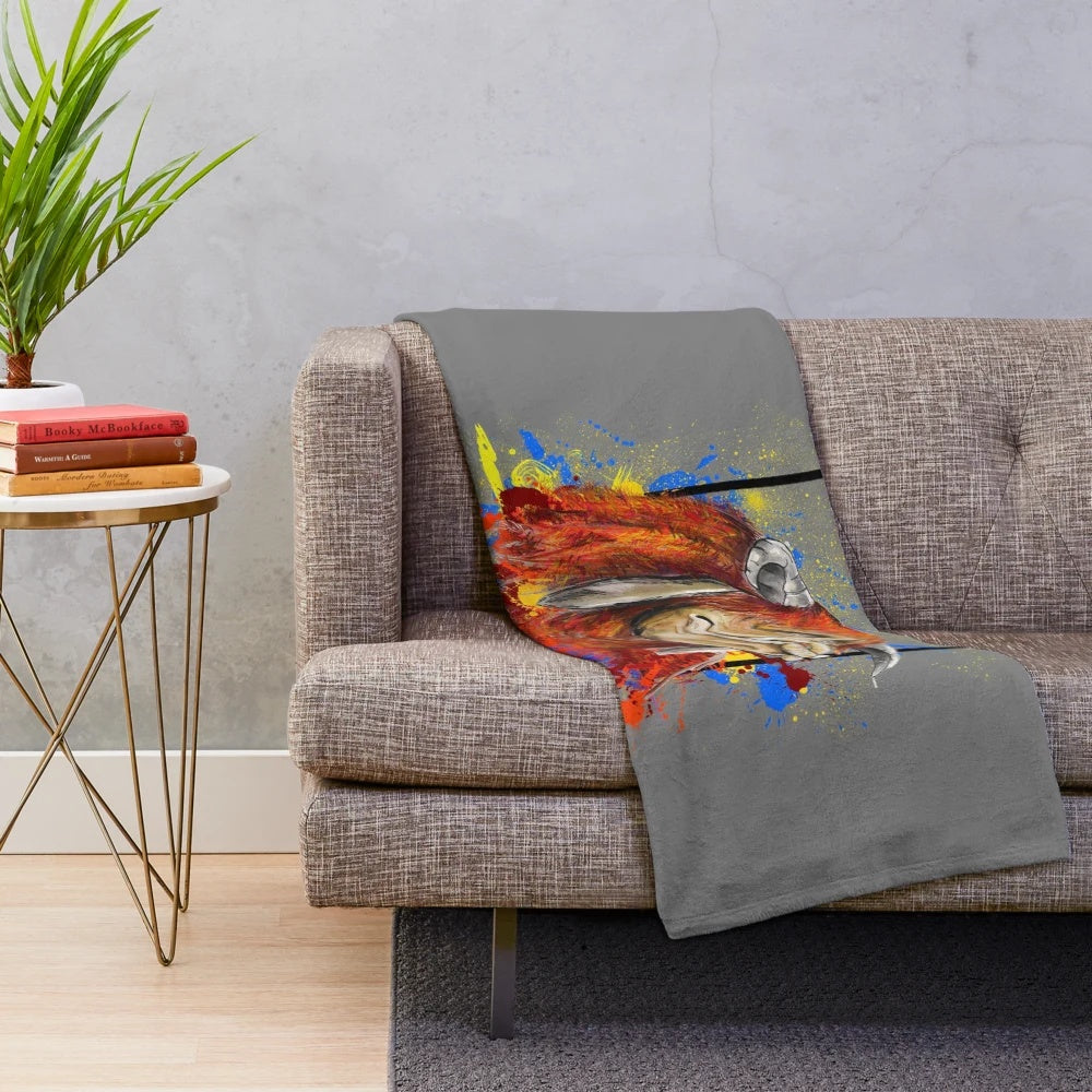Colorful plush blanket featuring a ludo board game and fantasy creature design
