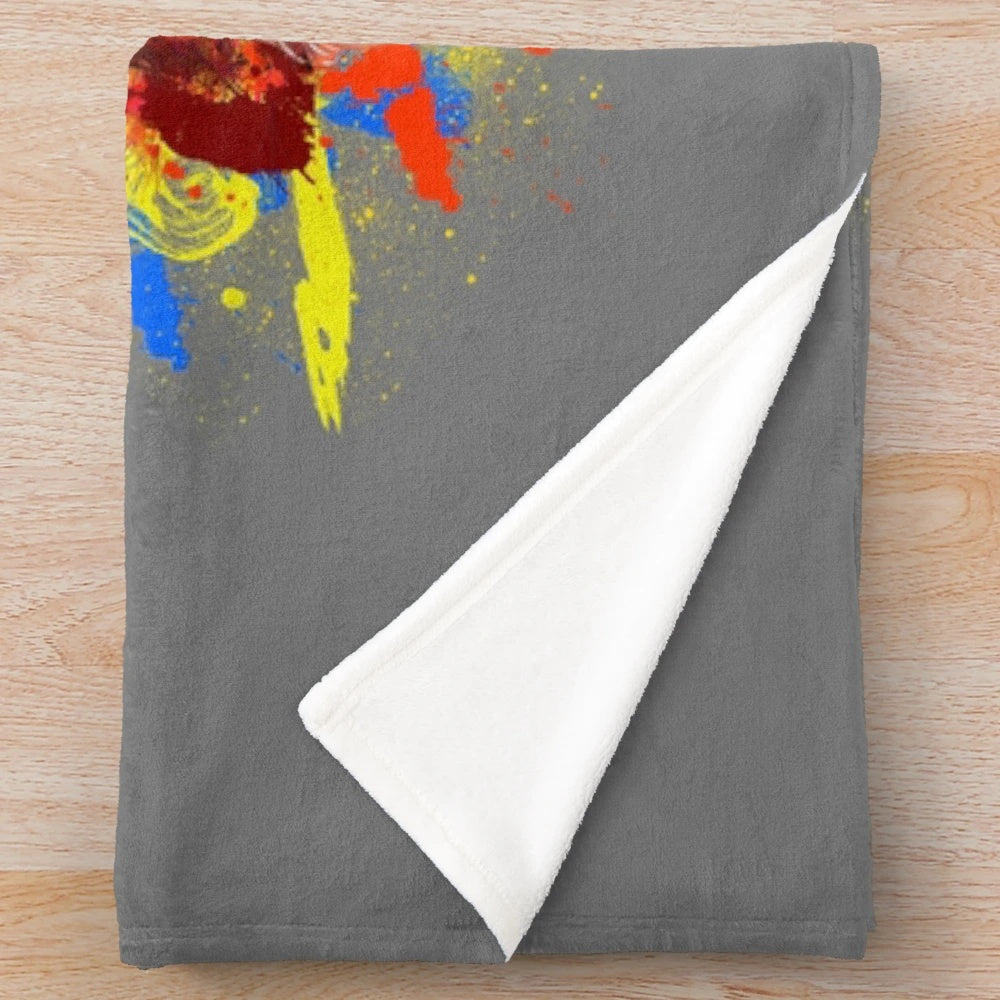 Colorful plush blanket featuring a ludo board game and fantasy creature design