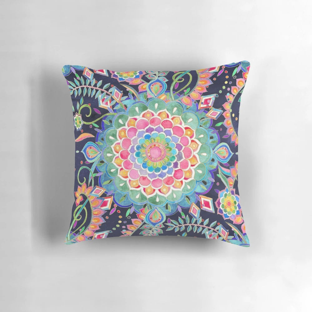 Vibrant, hand-drawn mandala design on a soft, decorative pillow