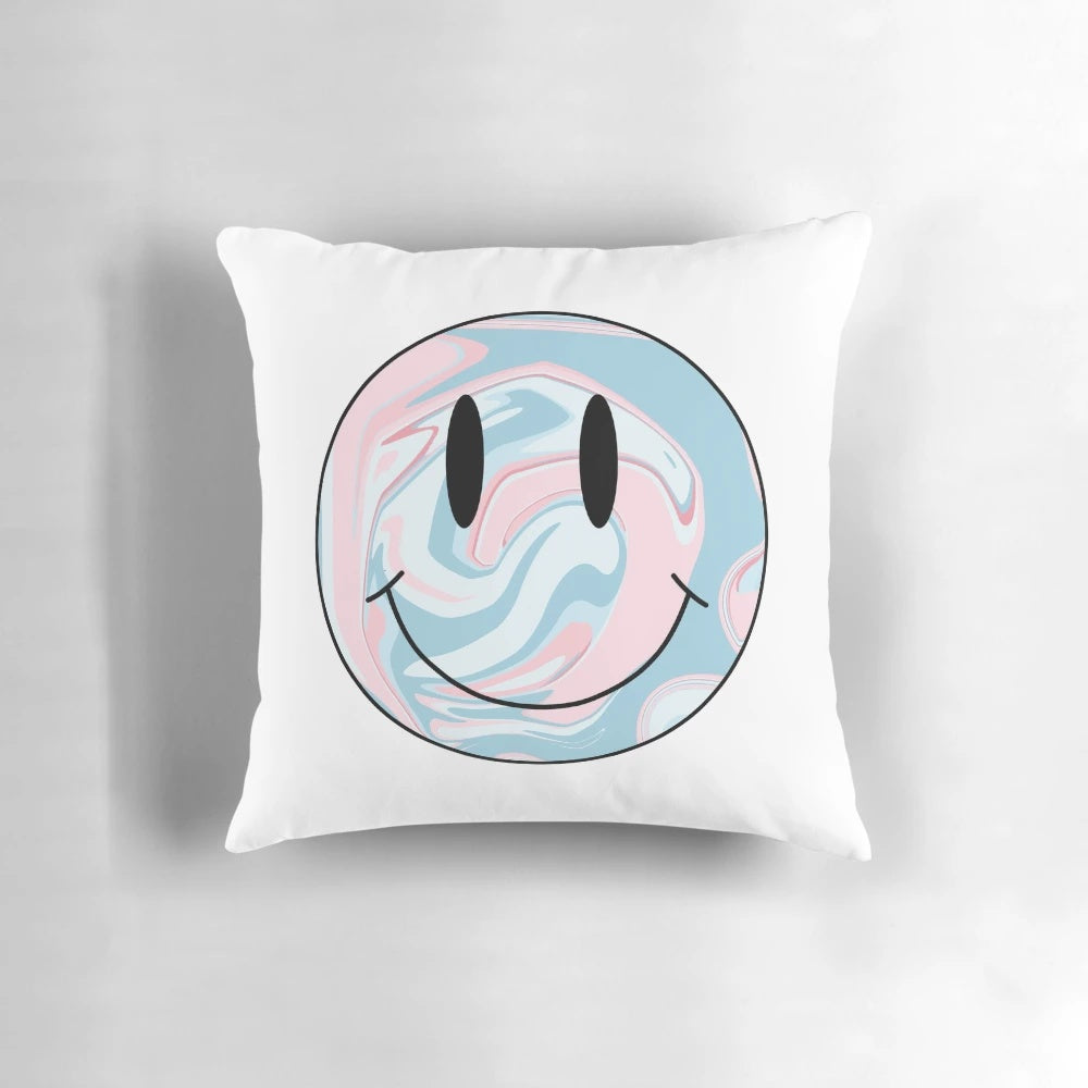 A colorful marble-patterned pillow with a happy smiley face design, perfect for adding a touch of whimsy to any space.