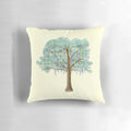 Watercolor painting of a colorful Mardi Gras tree with beads and foliage on a throw pillow