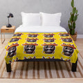 Colorful plush blanket featuring a playful mariachi piñata design