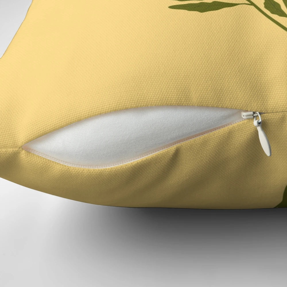 Marigold flowers blooming in a lush, botanical design on a decorative throw pillow