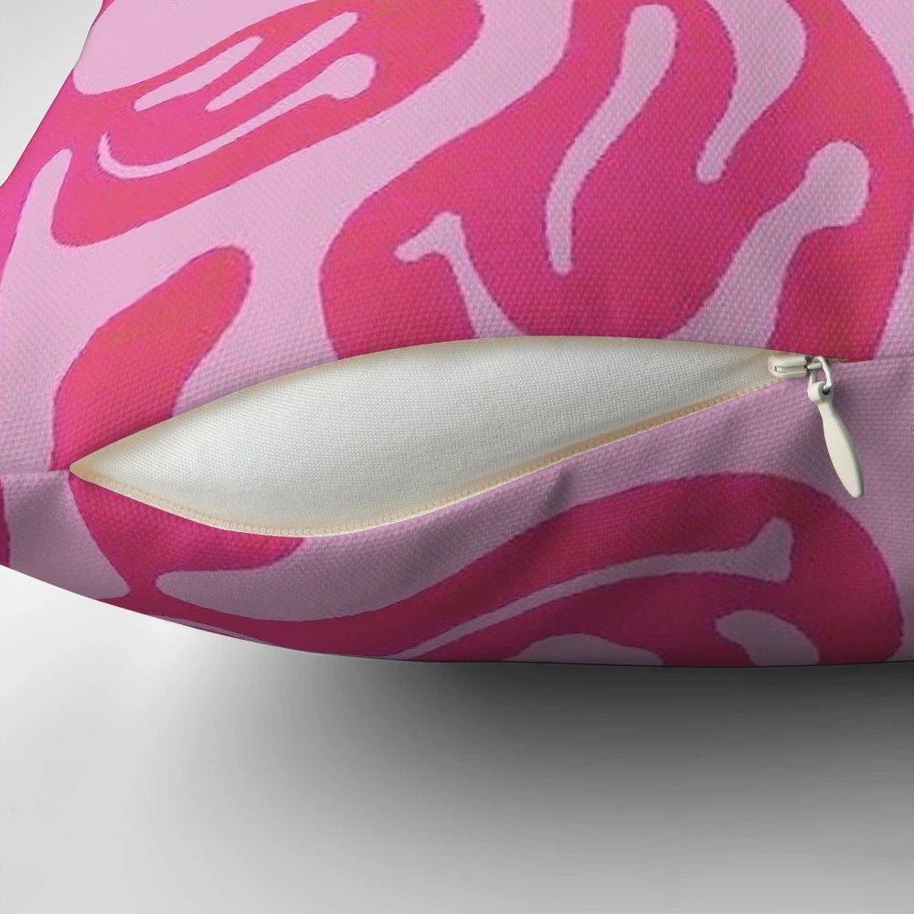 Colorful melted smiley face design on a pink pillow, with a psychedelic, vibrant pattern.