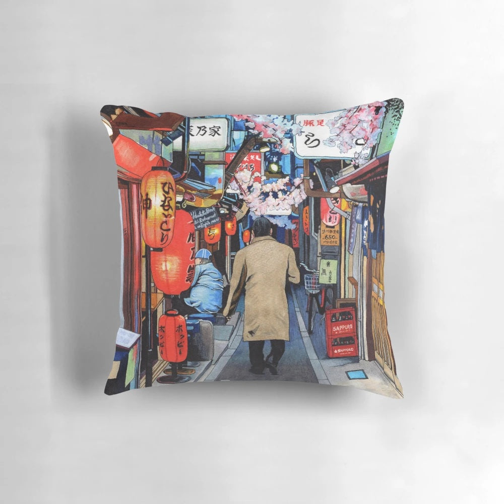 A colorful pillow featuring a spring streetscape in Tokyo, Japan with cherry blossoms, neon signs, and an industrial urban atmosphere.