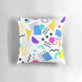 Colorful Memphis-inspired decorative pillow with geometric patterns and watercolor-like design.