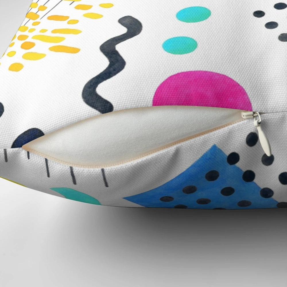 Colorful Memphis-inspired decorative pillow with geometric patterns and watercolor-like design.