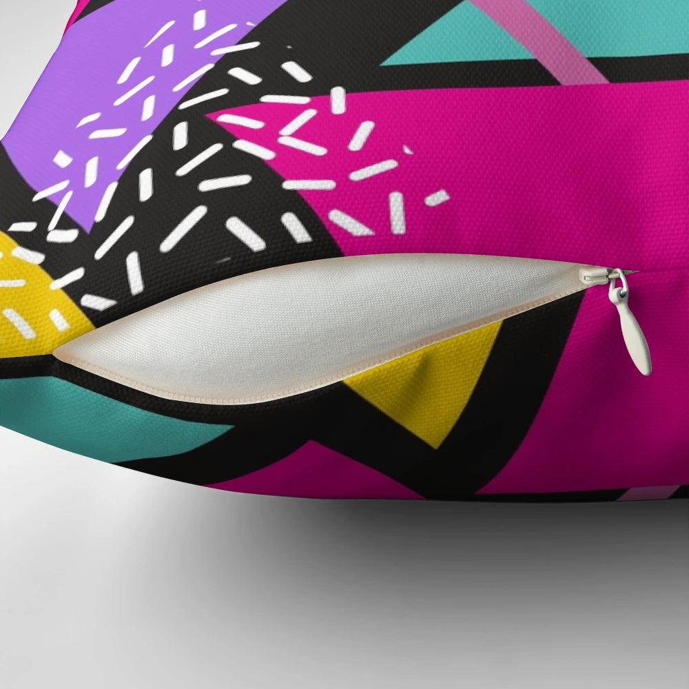 Colorful Memphis-inspired triangle pattern pillow with a vintage, geometric design.