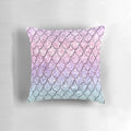 Colorful pillow with a digital collage design featuring mermaid scales and unicorn-inspired glitter patterns.
