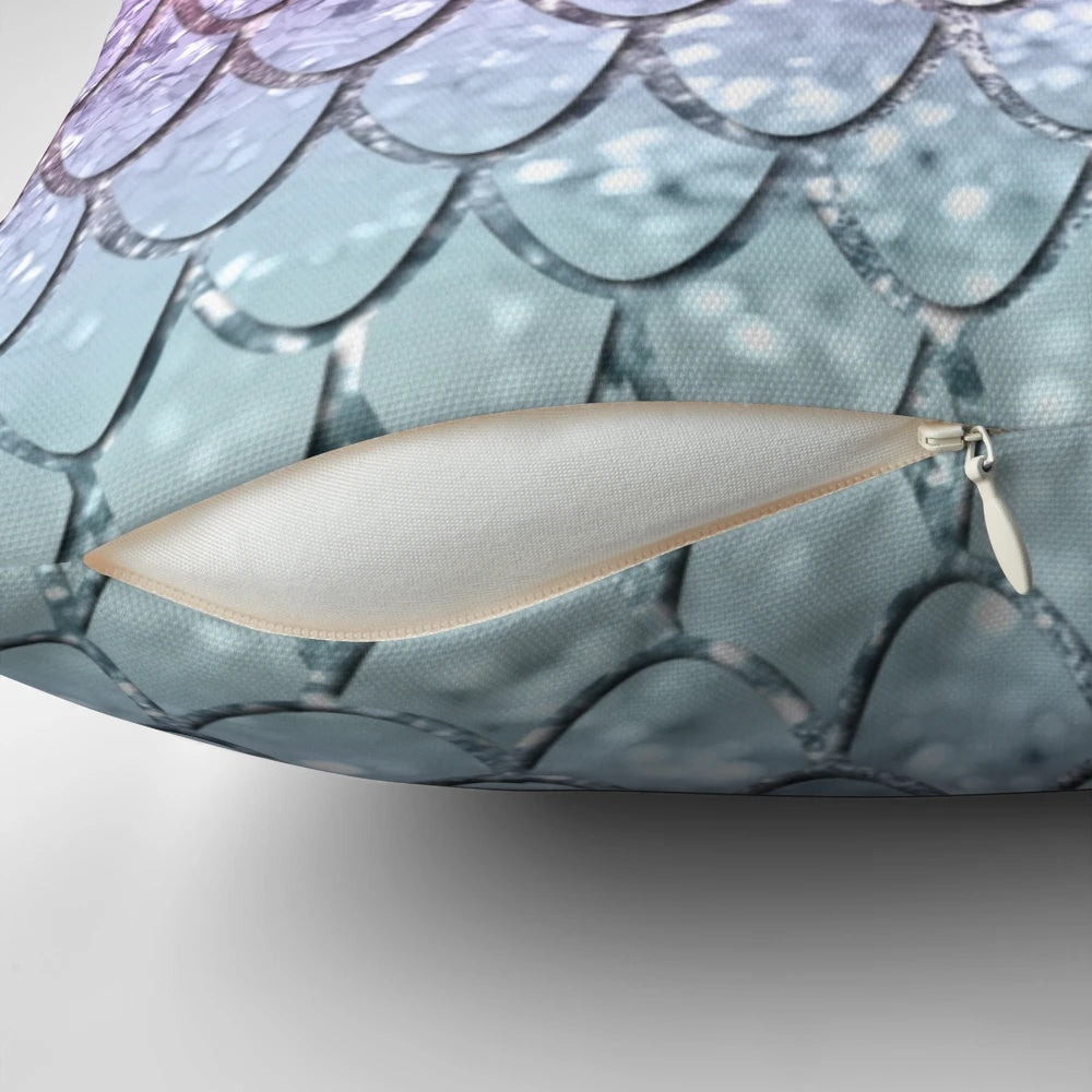 Colorful pillow with a digital collage design featuring mermaid scales and unicorn-inspired glitter patterns.