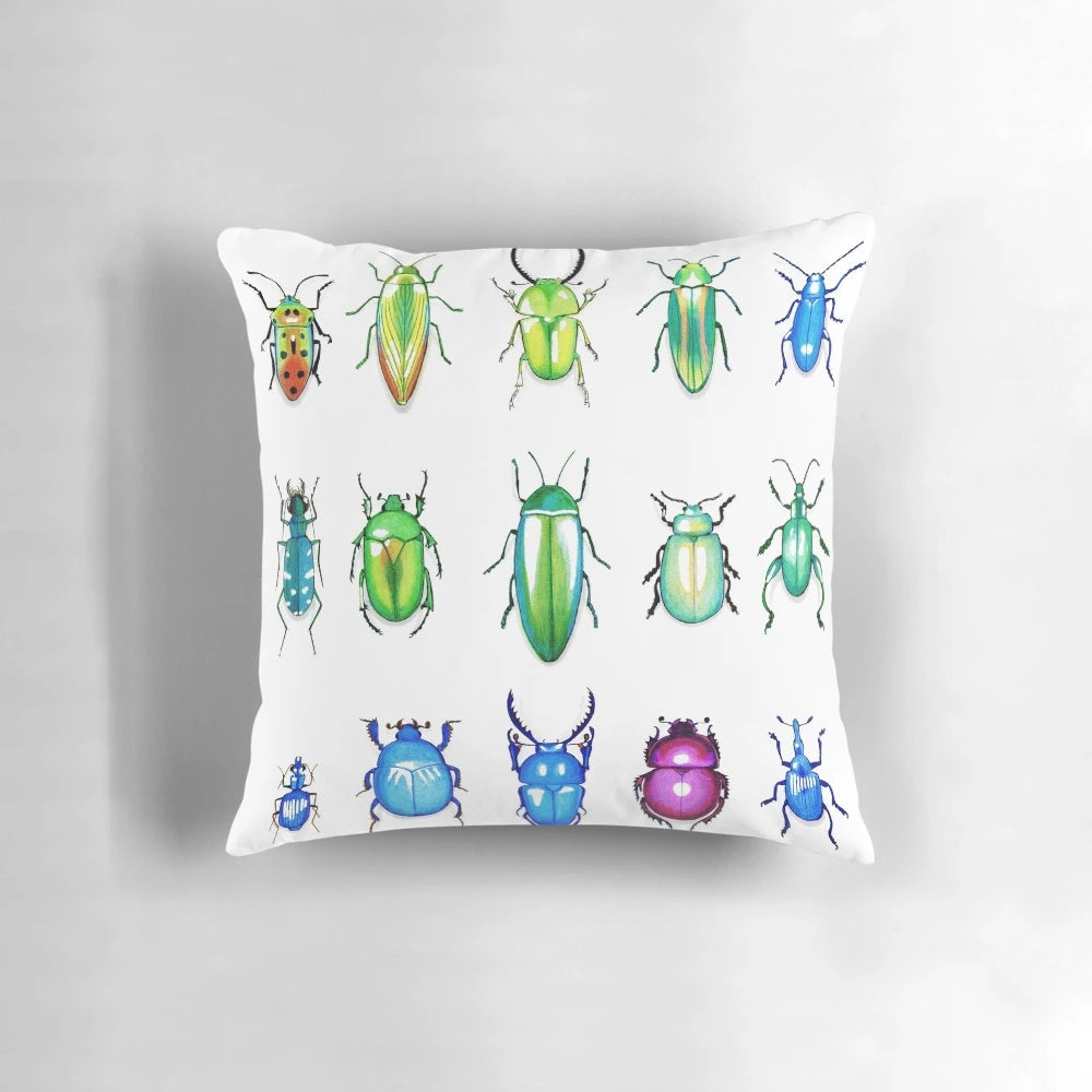 Colorful metallic beetles printed on a decorative throw pillow