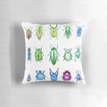 Colorful metallic beetles printed on a decorative throw pillow