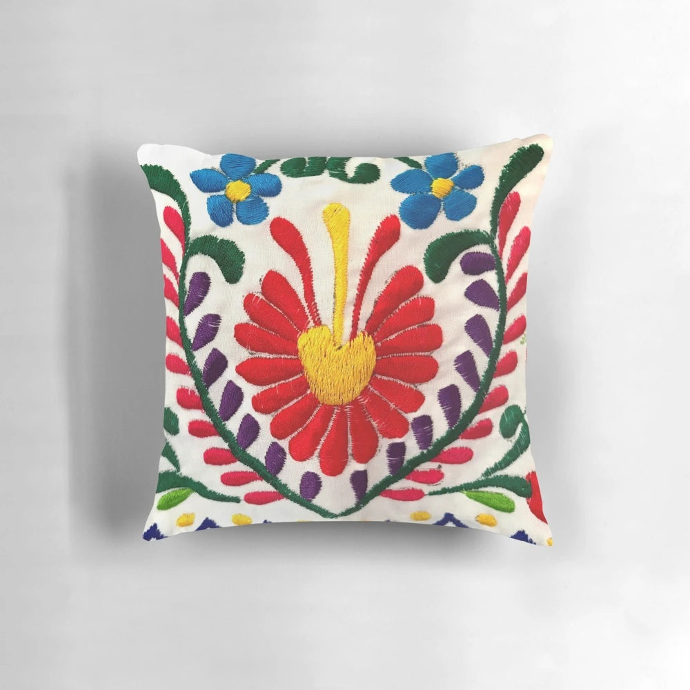 Colorful Mexican-inspired floral throw pillow with red flowers