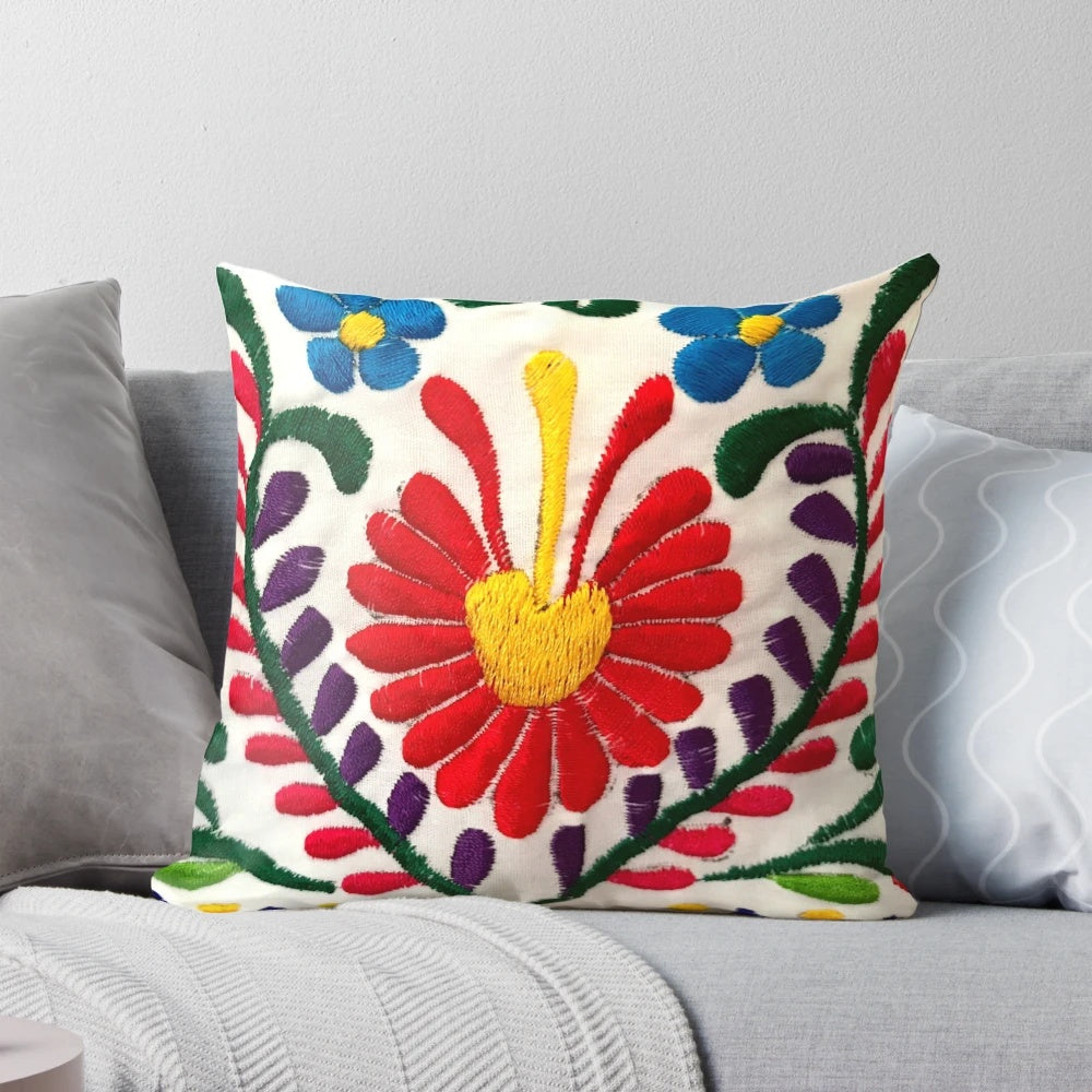 Colorful Mexican-inspired floral throw pillow with red flowers