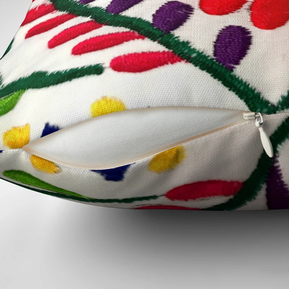Colorful Mexican-inspired floral throw pillow with red flowers