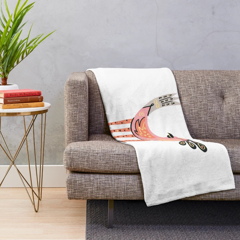 Colorful plush blanket featuring a fantastical bird-like alebrije design, inspired by Mexican folk art