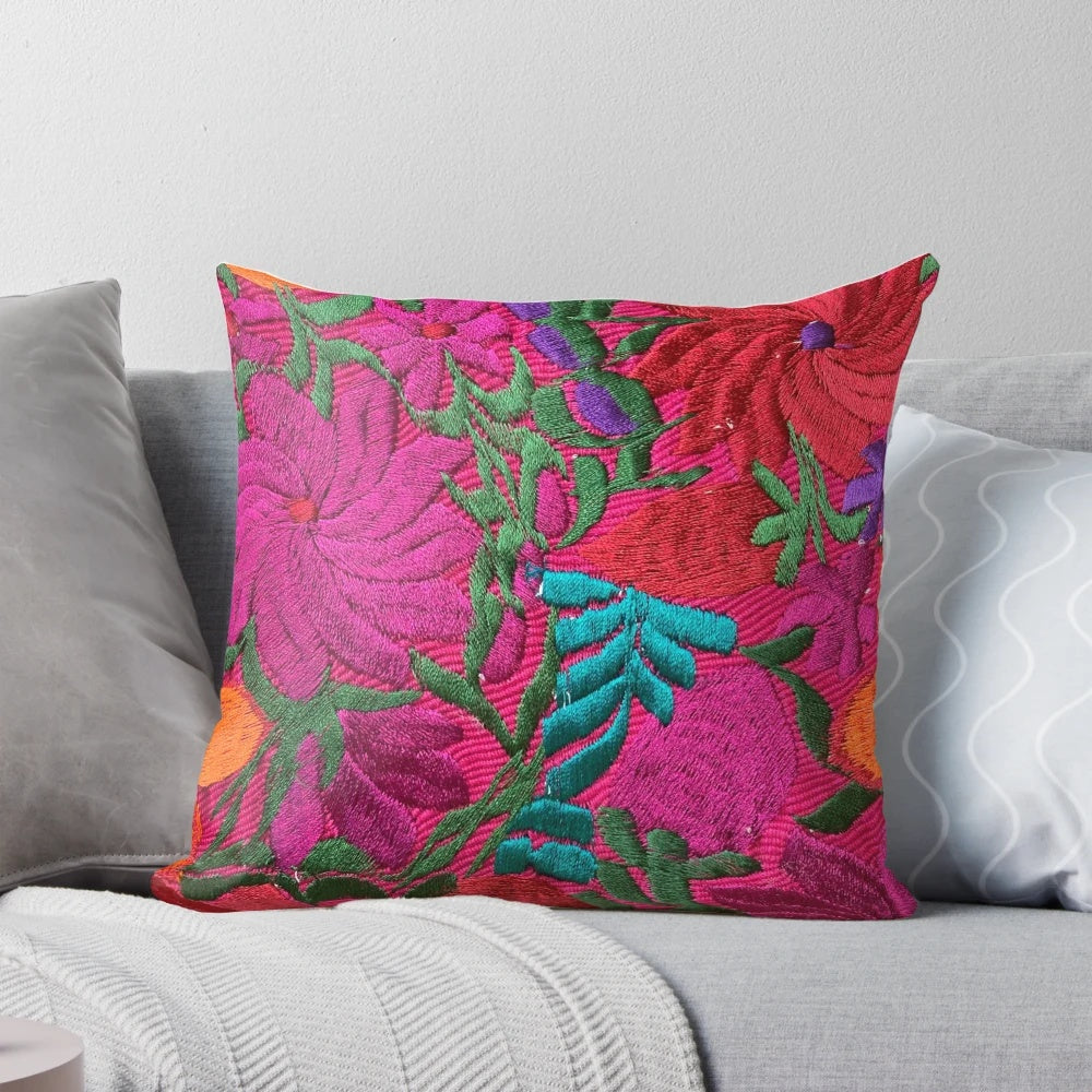 Colorful, embroidered Mexican-style pillow with floral patterns