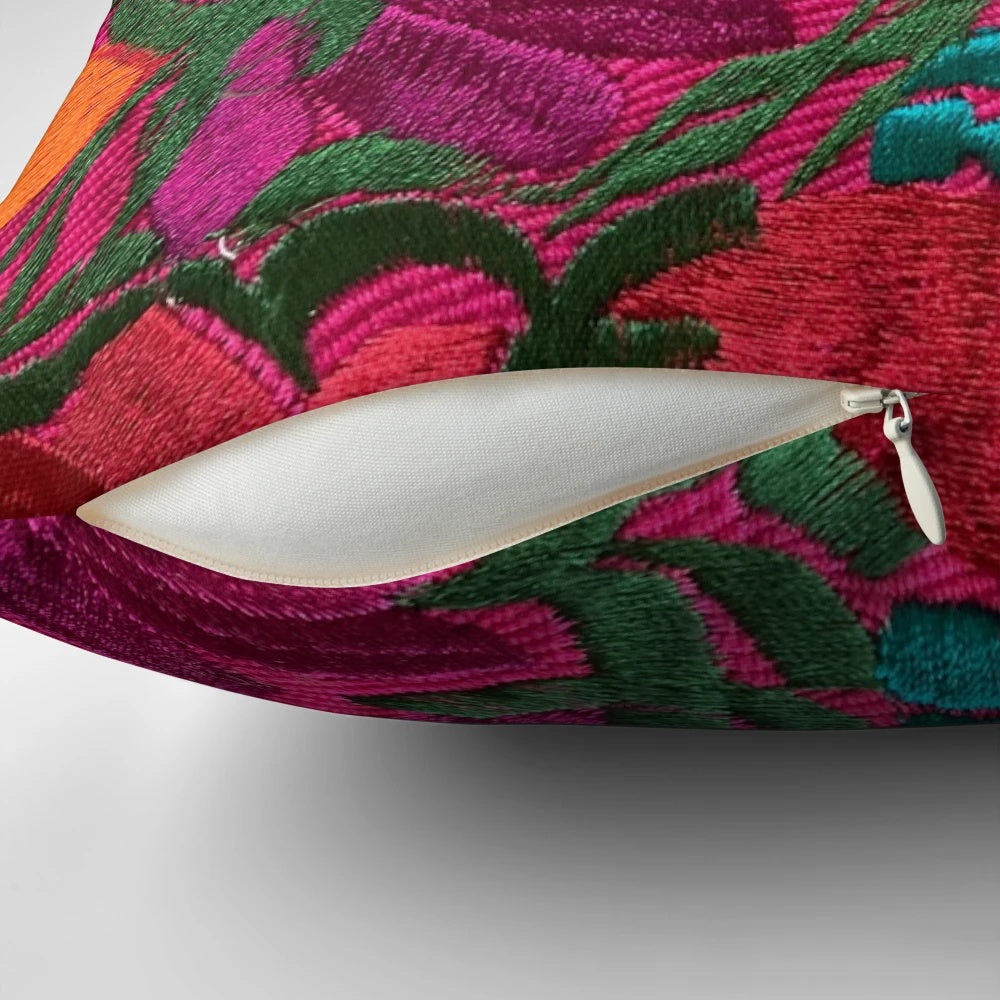 Colorful, embroidered Mexican-style pillow with floral patterns