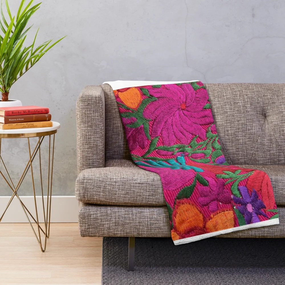 Colorful embroidered Mexican-style plush blanket with floral designs