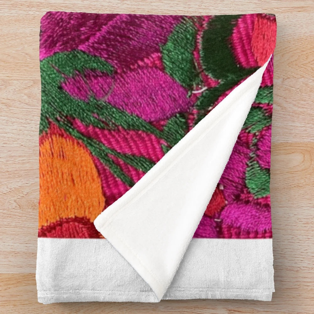 Colorful embroidered Mexican-style plush blanket with floral designs