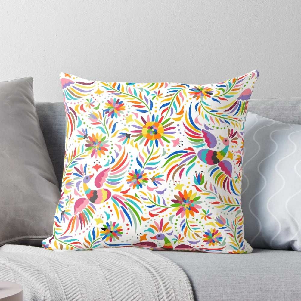 Colorful throw pillow featuring a seamless, ornate Mexican-inspired pattern with birds and floral elements.