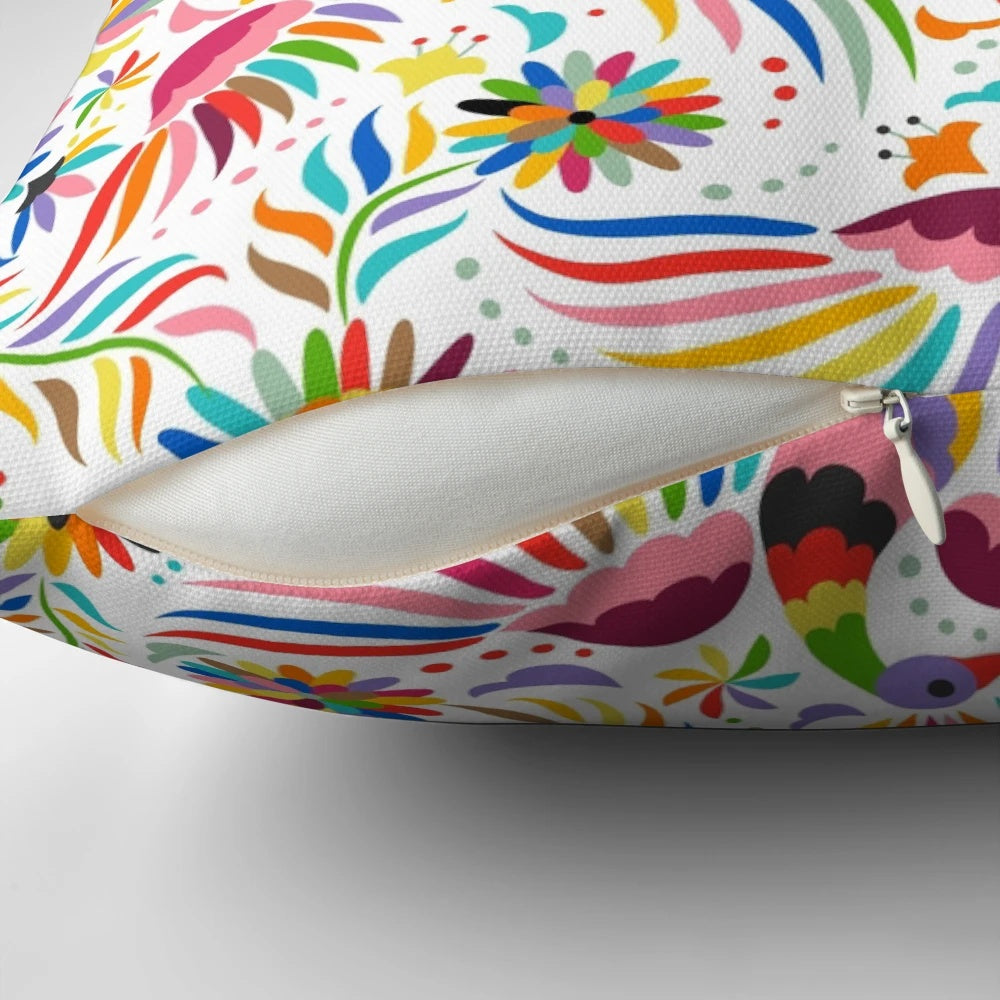 Colorful throw pillow featuring a seamless, ornate Mexican-inspired pattern with birds and floral elements.