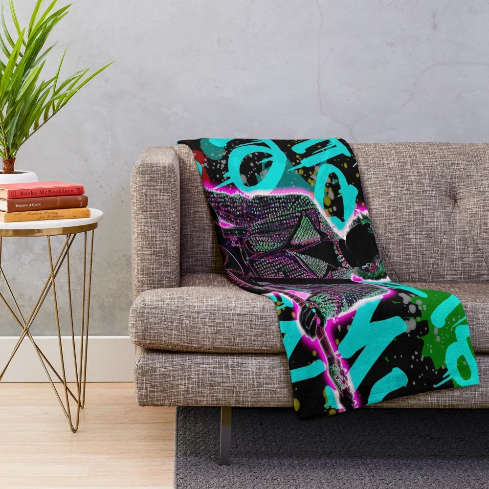 Colorful plush blanket with graffiti-style MGK illustration
