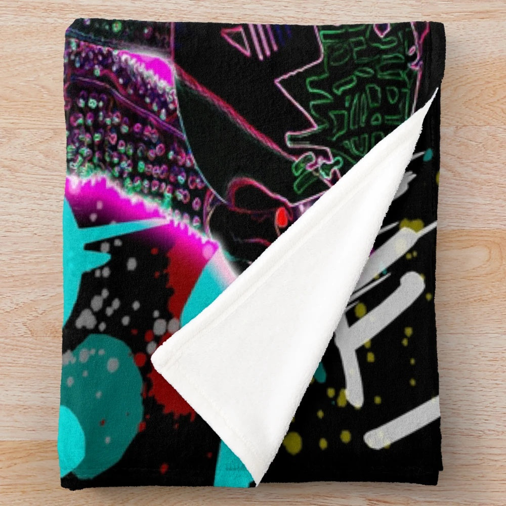 Colorful plush blanket with graffiti-style MGK illustration