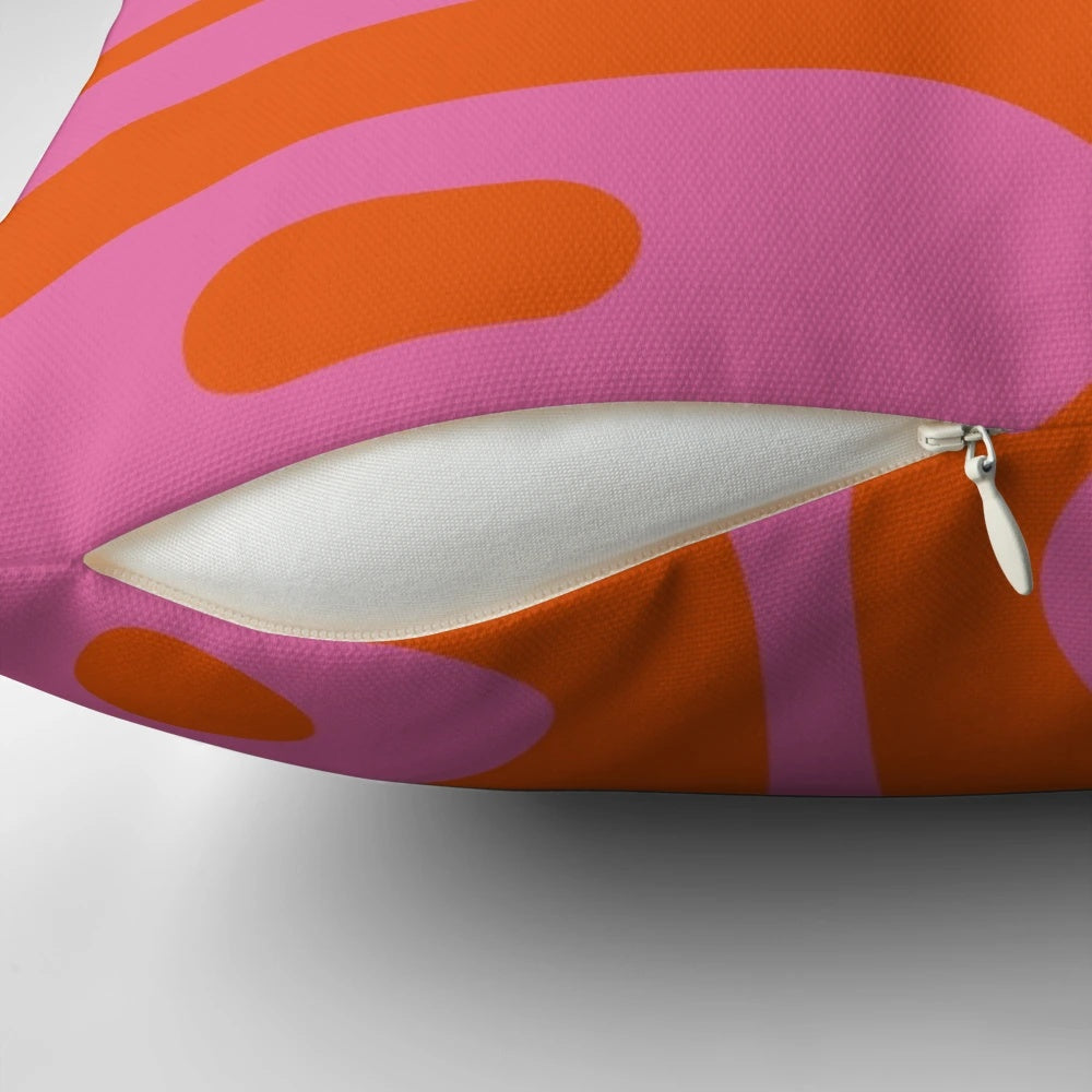 Colorful mid-century modern style abstract pattern throw pillow in pink and orange hues