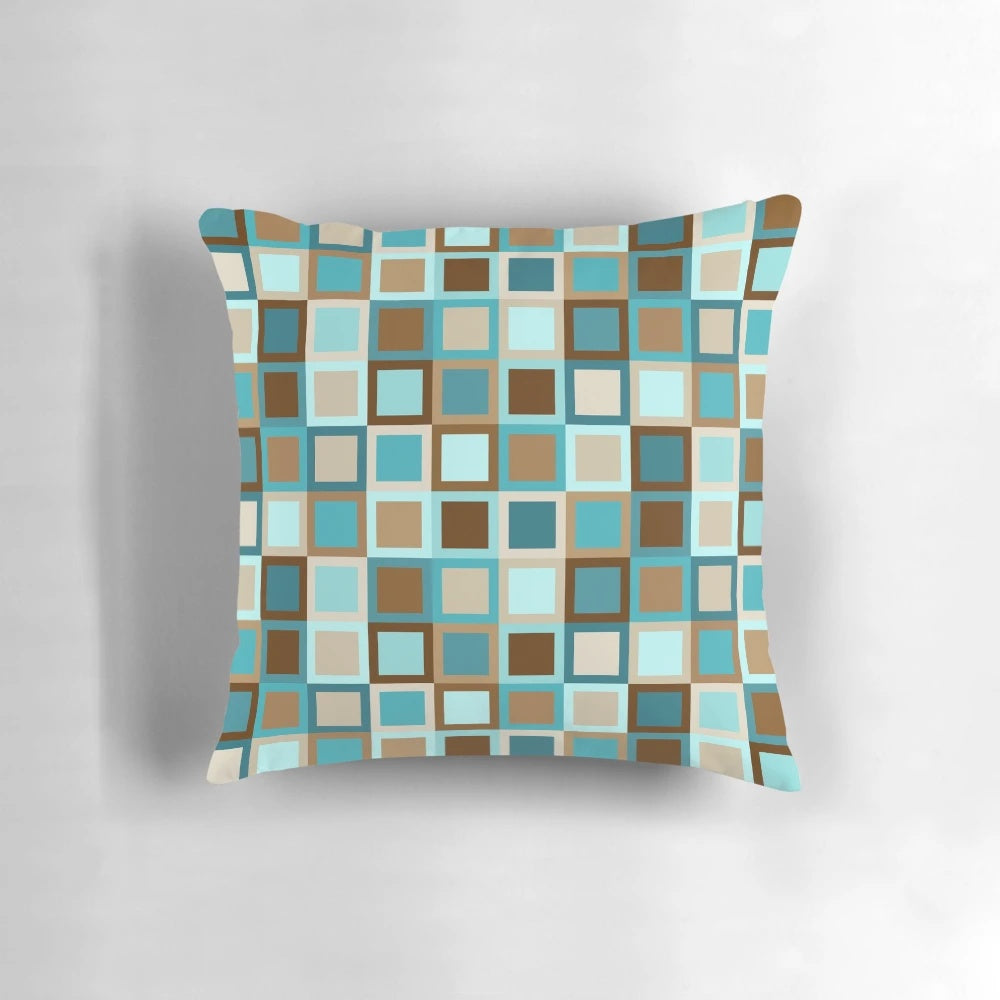 Mid century modern geometric square patterned throw pillow in earthy tones of brown, teal, turquoise, caramel, khaki, tan, and sky blue.