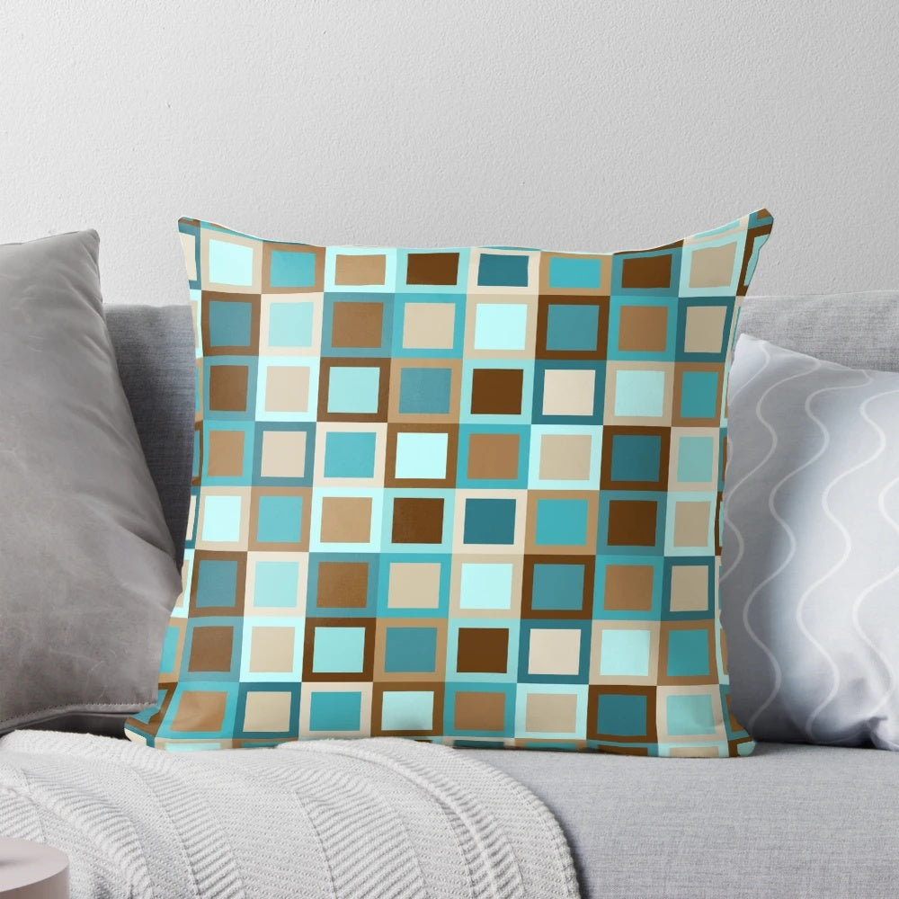 Mid century modern geometric square patterned throw pillow in earthy tones of brown, teal, turquoise, caramel, khaki, tan, and sky blue.