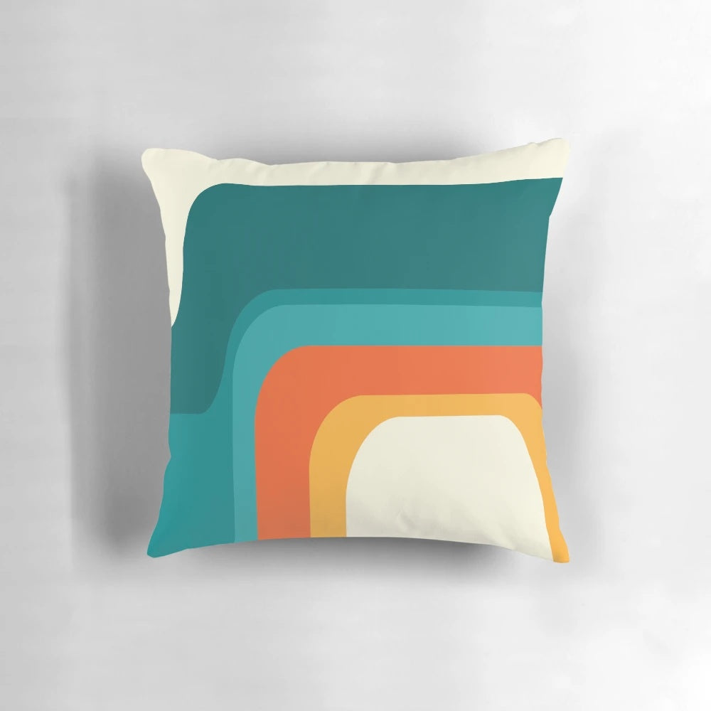 Colorful mid-century modern style rainbow throw pillow with teal, yellow, and orange hues