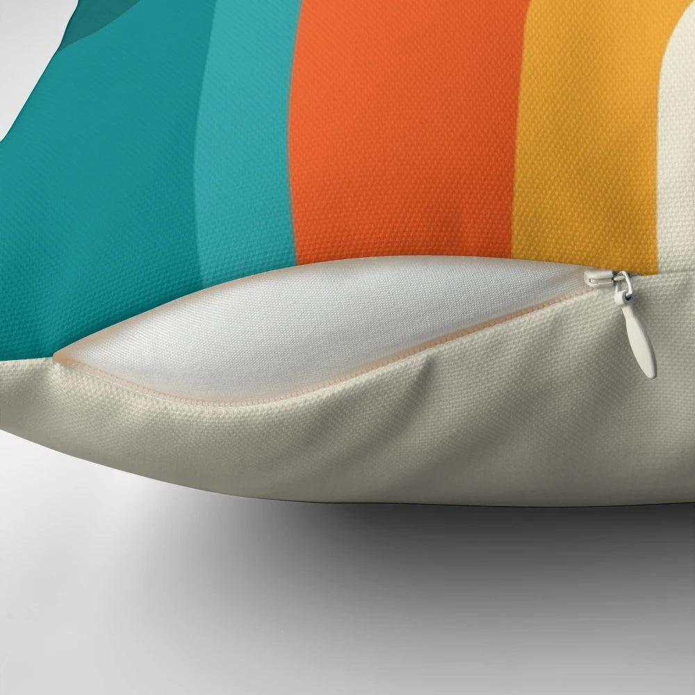 Colorful mid-century modern style rainbow throw pillow with teal, yellow, and orange hues