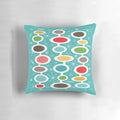 Colorful mid-century modern oval design throw pillow with abstract bubble pattern, inspired by atomic era art