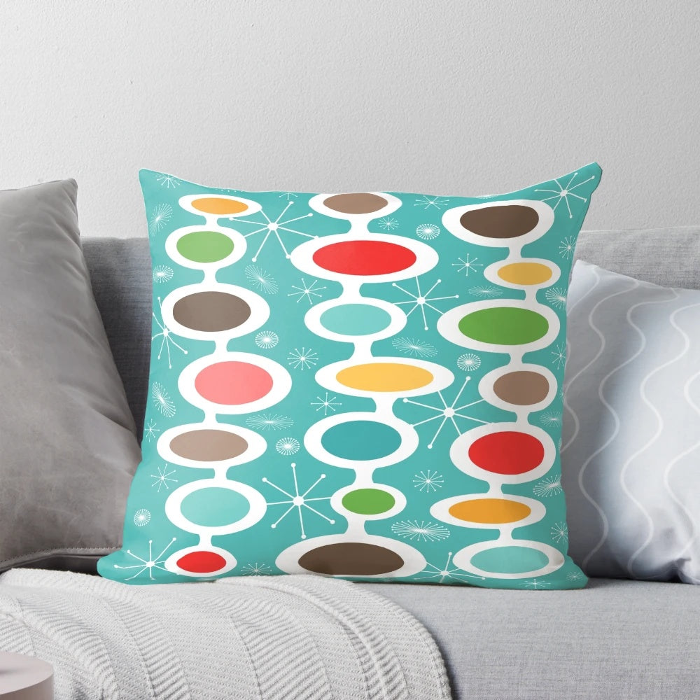 Colorful mid-century modern oval design throw pillow with abstract bubble pattern, inspired by atomic era art