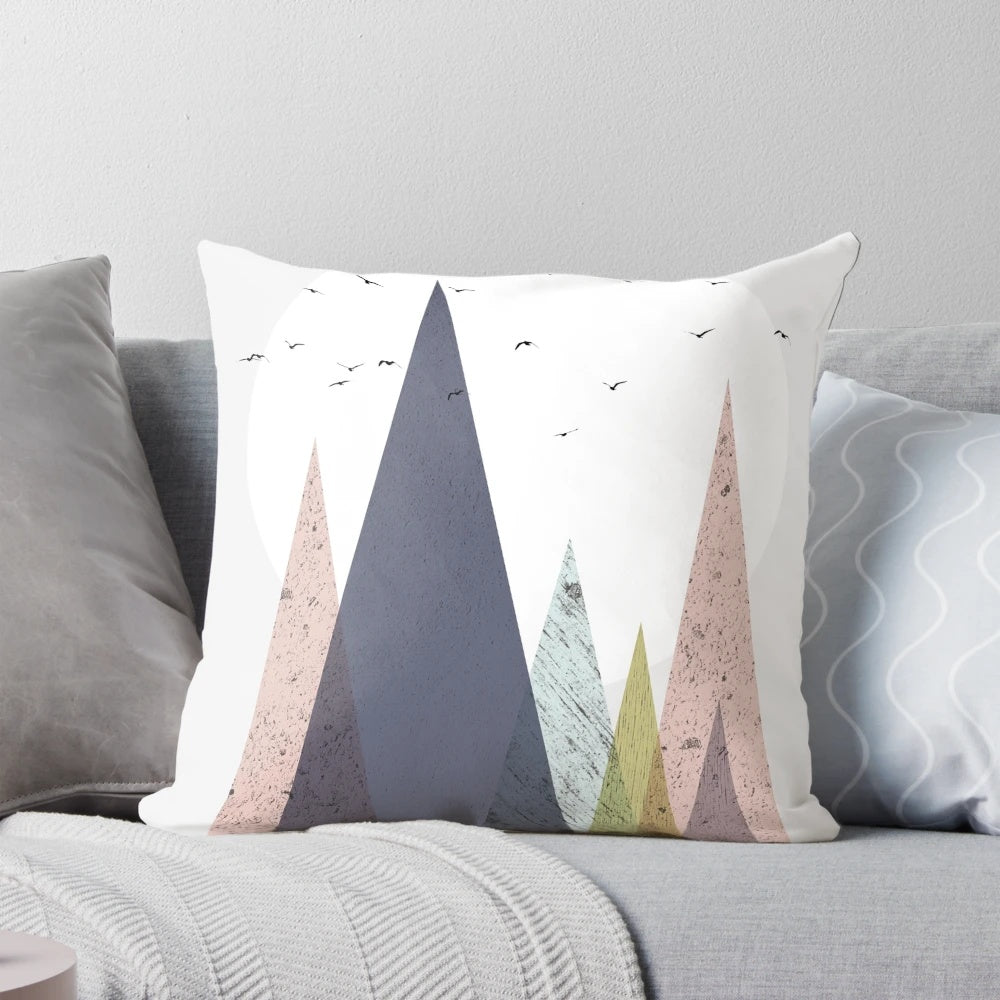 Colorful mid-century inspired pillow with a scandinavian mountain landscape design