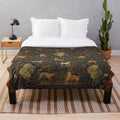 Millefleurs tapestry plush blanket featuring a fantasy medieval scene with a unicorn, deer, and other mythical creatures