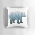 Turquoise watercolor bear pillow with abstract forest background