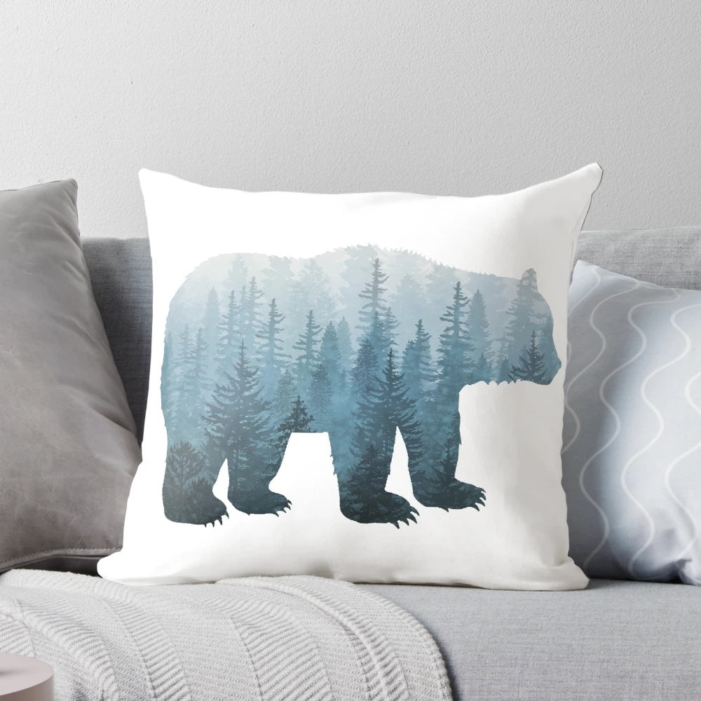 Turquoise watercolor bear pillow with abstract forest background