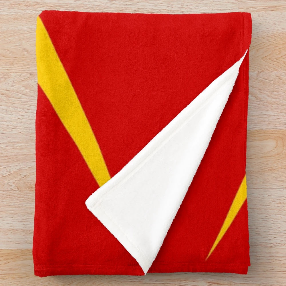 Mohawk-inspired plush blanket with vibrant red and yellow colors