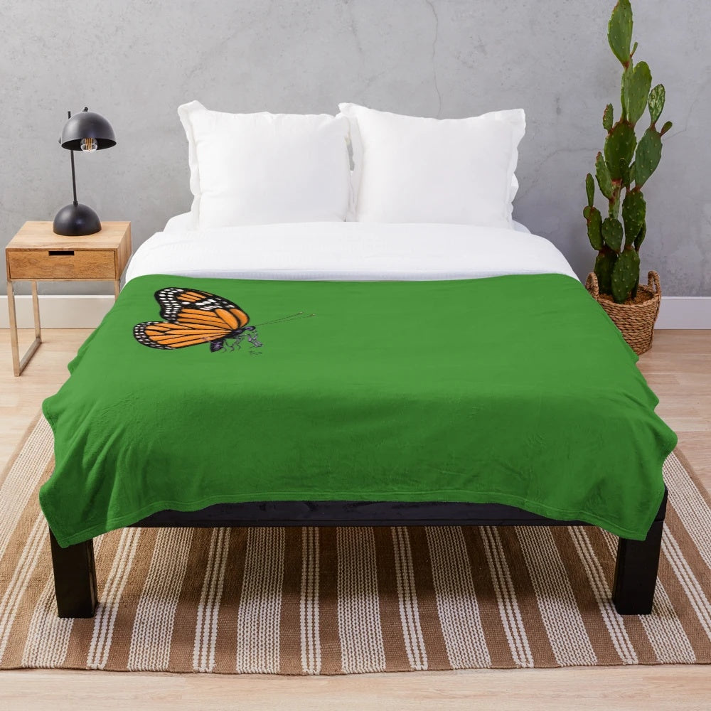 Soft, plush blanket with a colorful monarch butterfly print design