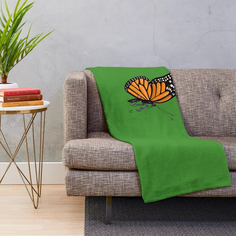 Soft, plush blanket with a colorful monarch butterfly print design
